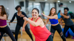 Five Women in activity wear dance-exercising with oodles of noodles